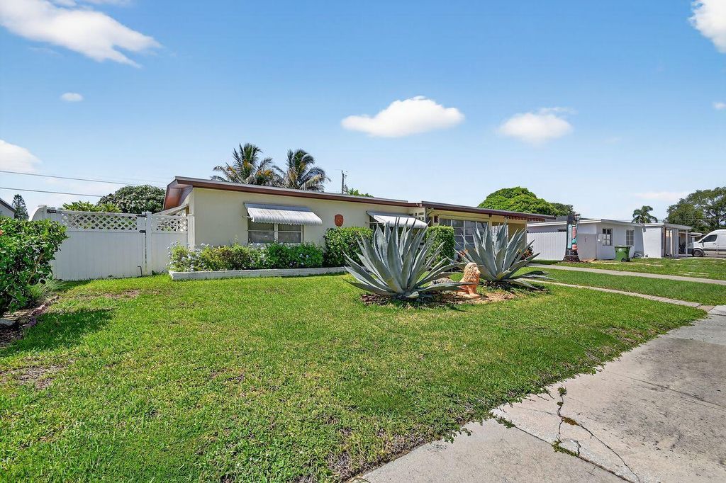 Photo of 133 Greenbrier Drive, Palm Springs, FL 33461 (MLS # R11110607)