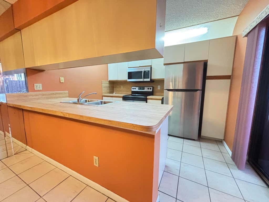 Photo of 1701 S CORAL Terrace #1701, North Lauderdale, FL 33068 (MLS # B26064655)