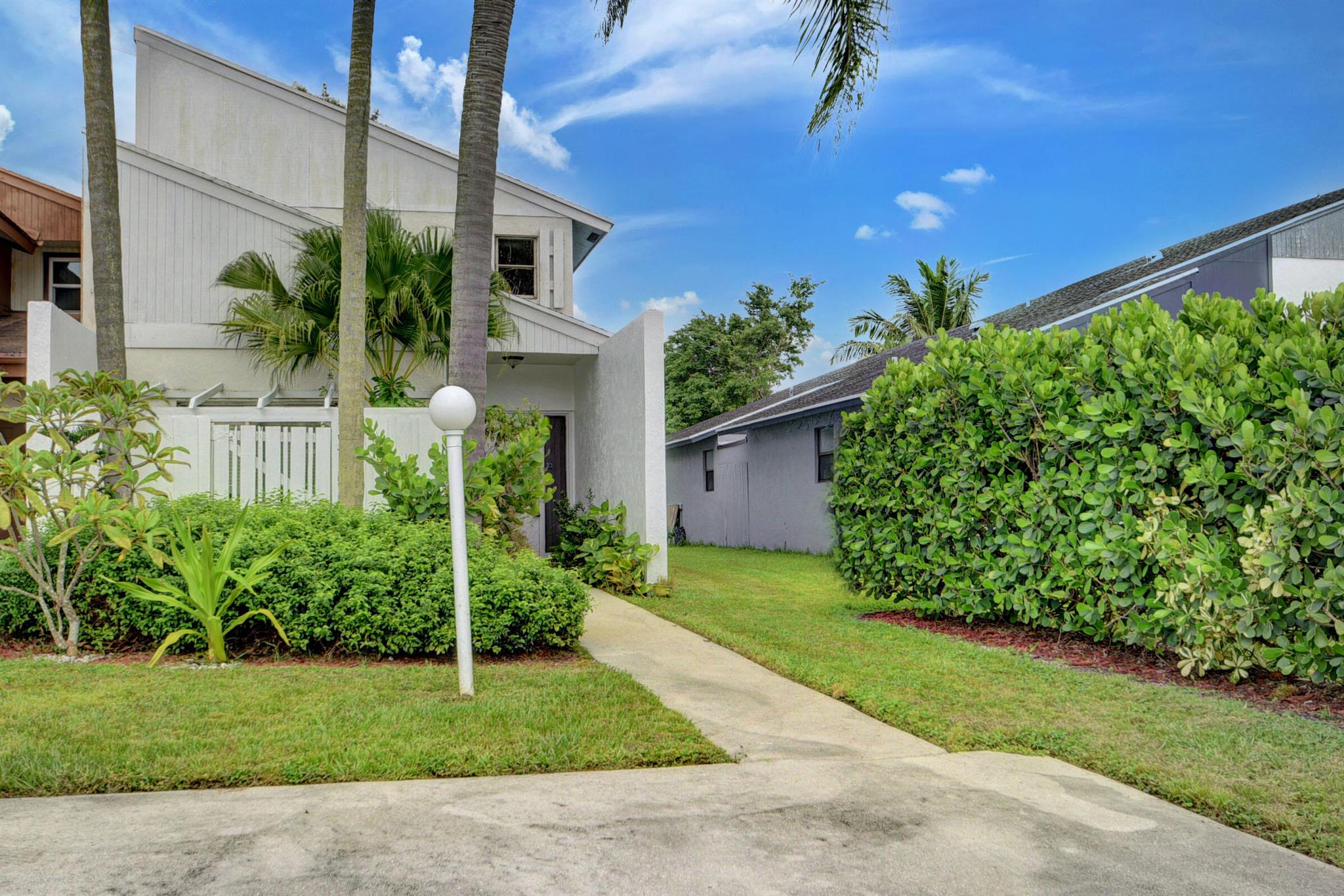 Make this charming 2 bedrooms home the perfect place to call home during the winter season. One bedroom in the first floor and the other in second floor . All the first floor with tile like wood easy to keep clean. Fence in yard and cover patio area will allowed you to enjoy the beautiful winter weather in Florida. Home features spacious living room with plenty of natural light, kitchen fully equipped. Large bedroom in the upstairs that features a nice walk in closet shower and tub. Fenced back yard with an enclosed patio perfect to entertain guests or let pets play. Walking distance to parks and shopping. MAKE THIS YOUR HOME!