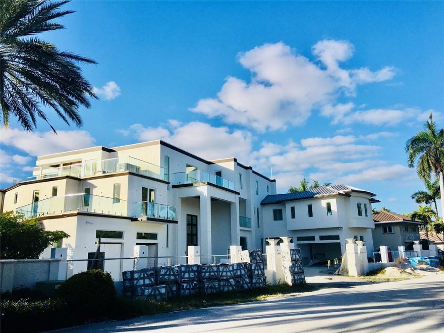 Exquisite LAS OLAS waterfront estate. Blends 3-story modern design, quality materials & craftsmanship, Intercoastal & skyline vistas, 140’ deep water dockage & every luxury amenity: Chef’s gas kitchen, top-of-the line appliances; bar, wine storage & tasting area; large formal dining, spacious family & living rooms perfect for displaying art & elegant yet casual living. 6-7 bedrooms; 2 master suites; spacious walk-in closets; home theater; game room & bar; large gym; 60’ pool; office; 2000+ sq ft of outdoor decks with dramatic water & skyline views perfect for entertaining; outdoor kitchen; garage for 8 cars; gas generator; commercial glass elevator; walled & gated; security cameras, commercial storm water drainage system, quick ocean access, walk to beach. 7-Isles 24/7 guarded & patrolled.