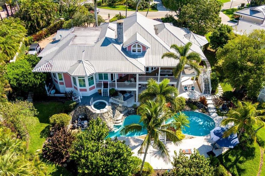 Discover this majestic, waterfront dream home in the Sewalls Point neighborhood of Castle Hill, located on the St Lucie River. This stunning home features a 63' lagoon pool, spa & waterfall. You will love this home's private, sandy beach and tropical, landscaped grounds, deep water, ocean access, and new 13K lift! The panoramic views of the intercoastal waterway are unobscured with the new impact windows and doors and can be seen from almost every room. The kitchen has been recently remodeled with new cabinetry, granite and quartz countertops, wolf gas stove top, steam ovens, double wall oven, two cove dishwashers, subzero icemaker and more! The master suite opens to a relaxing spa, huge deck and picturesque views that are perfect for entertaining or simply relaxing with your morning coffee.