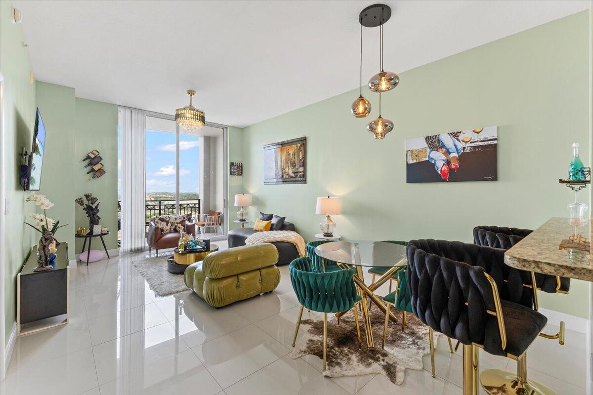 Experience luxury seasonal living in this beautifully furnished 1-bedroom, 1-bath penthouse in the highly sought-after CityPlace South Tower in West Palm Beach. This elegant unit boasts marble flooring throughout, a stylish kitchen with granite countertops, stainless steel appliances, and ample cabinetry. The spacious primary suite offers a large walk-in closet, and a stackable washer and dryer are conveniently located in the utility closet. Enjoy impact-rated windows and breathtaking city views from your private balcony. As a resident, you'll have access to upscale amenities, including a 24-hour front desk, valet parking, a modern fitness center, a infinity edge heated pool and spa, and beautifully designed communal spaces for relaxation and entertaining.
