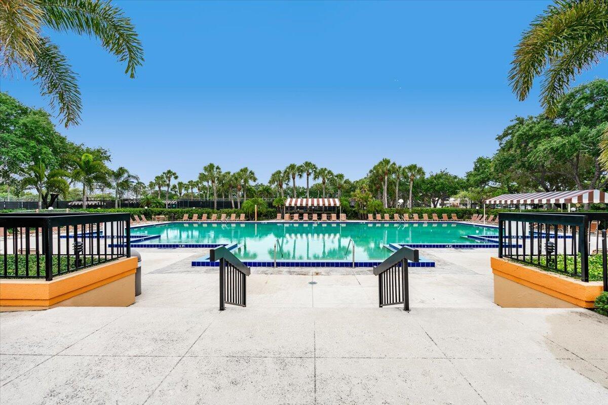 This move-in ready townhouse is located in the heart of West Palm Beach, close to everything. As you enter this well maintained townhome, you'll be greeted by a bright and spacious living area. The open floor plan connects the oversized living room to the dining area and kitchen, making it convenient for entertaining guests or relaxing with family. Upstairs, you'll find two oversized bedrooms, each with its own ensuite bathroom. The master bedroom has a large walk-in closet and a double sink. Outside, you'll find a private patio perfect for enjoying Florida's beautiful weather. Neighborhood consist of a community pool, basketball, jogging path, tennis court and much more. Convenient to beaches , airport and downtown . A must see!