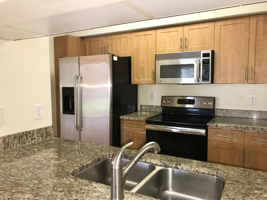 Photo of 6533 Emerald Dunes Drive #107, West Palm Beach, FL 33411 (MLS # R11014709)