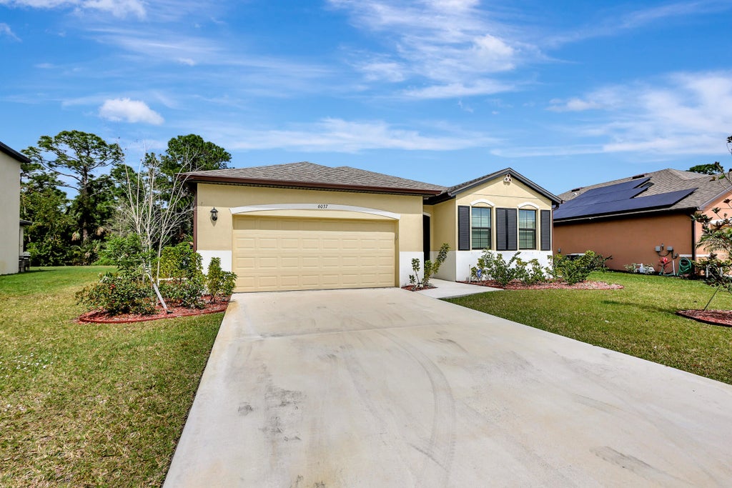 Photo of 6037 NW Regent Street, Port Saint Lucie, FL 34983 (MLS # R10963988)