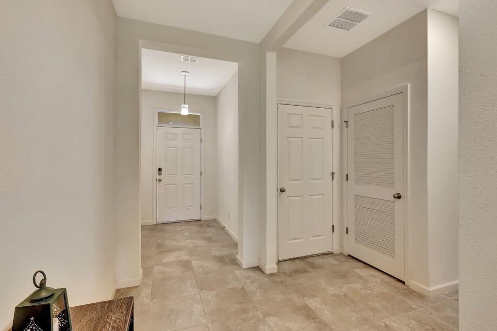 Photo of 6037 NW Regent Street, Port Saint Lucie, FL 34983 (MLS # R10963988)