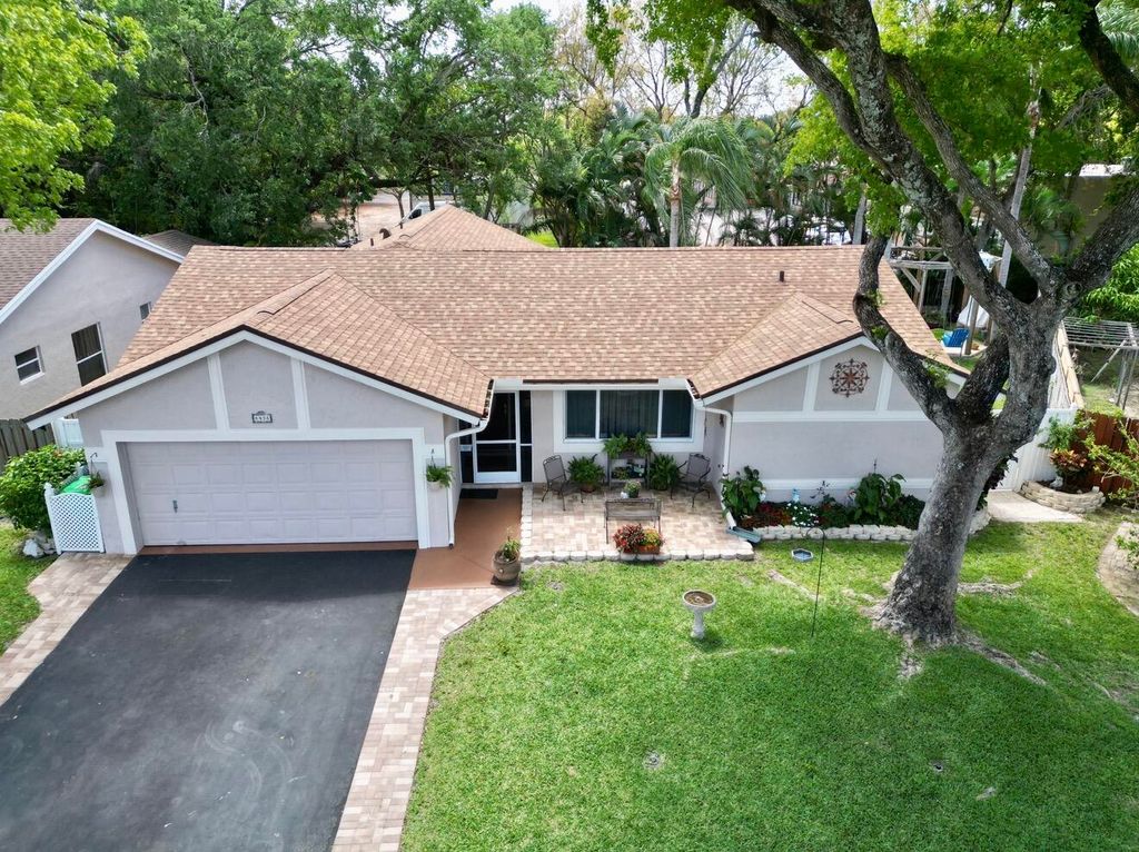 Photo of 8438 NW 34th Manor, Sunrise, FL 33351 (MLS # B26011230)