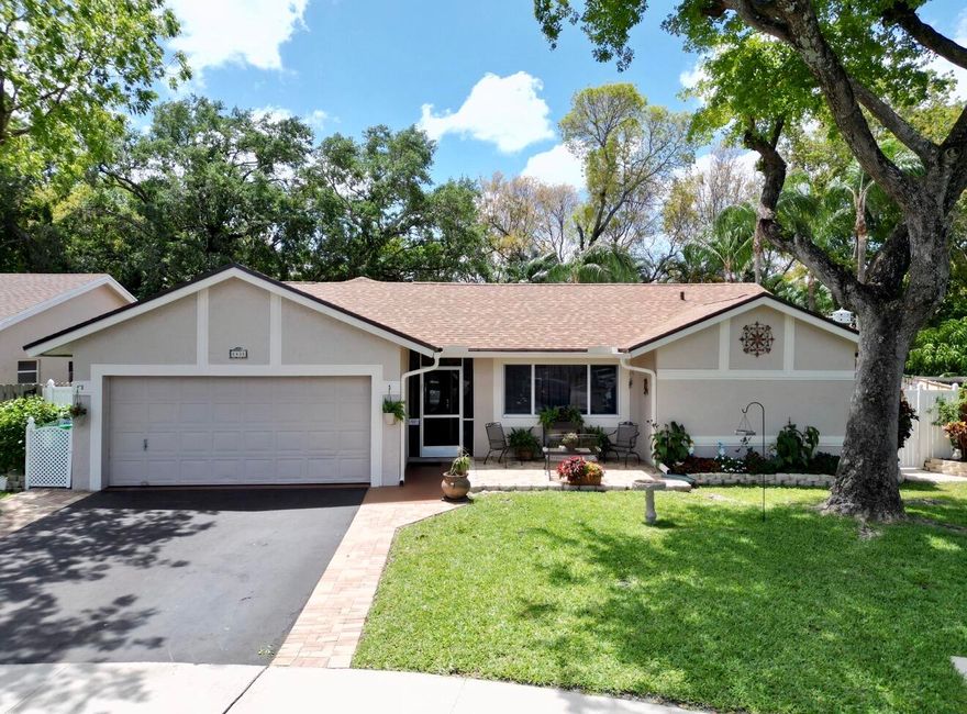 Welcome to this beautifully maintained 3/2 home, ideally situated on a quiet cul-de-sac in the desirable community of Springtree Isles in the heart of Sunrise. Proudly owned by its original owners, this residence has been thoughtfully updated and meticulously cared for over the years. Major improvements provide peace of mind, including a brand-new roof (2024), full impact windows (2023), A/C (2023), tankless water heater (2021), a renovated guest bathroom, newer flooring, and an updated kitchen featuring real wood cabinetry and newer appliances. Inside you'll love the bright, open feel created by vaulted ceilings and a spacious split-bedroom floor plan. Generously sized living areas, large bedrooms, and a walk-in closet in the primary suite offer both comfort and functionality. Enjoy true  South Florida living with 1,665 SF under air plus an expansive 655 SF screened-in patio. Perfect for relaxing or entertaining year-round. The fully fenced backyard is a private oasis, complete with lush landscaping, a cozy fire pit area, and unique hanging Adirondack chairs. The 2-car garage is ideal for car enthusiasts, wood hobbyists, or anyone in need of extra workspace. Conveniently located just minutes from Sawgrass Mills and Florida's Turnpike, with shopping, dining, and everyday essentials nearby. A new freestanding ER is set to open less than a mile away, along with a new Baptist Health hospital just 3 miles from the home adding even more value and convenience to this fantastic location.