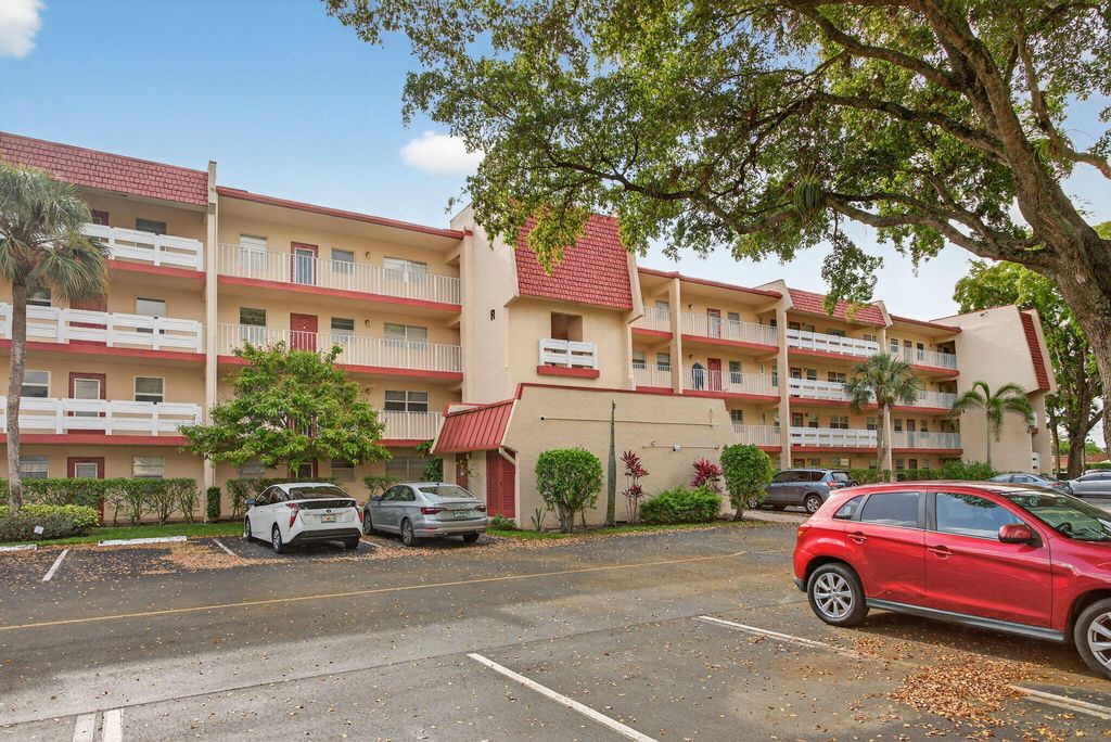 Photo of 1030 Country Club Drive #407, Margate, FL 33063 (MLS # B26011047)