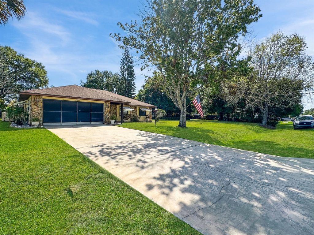 Photo of 5300 Paleo Pines Circle, Fort Pierce, FL 34951 (MLS # R10971163)