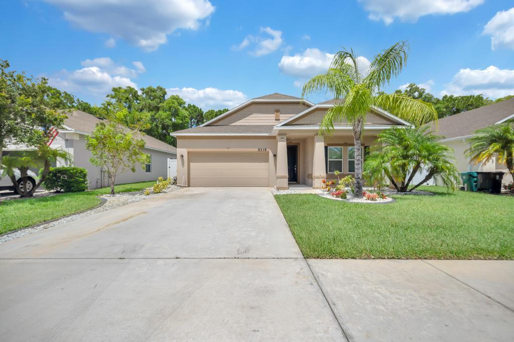 This newer, spacious 3-bedroom, 2-bathroom home is a perfect blend of modern design and comfort. Upon entering, you'll be greeted by an open-concept living area with high ceilings and plenty of natural light pouring in through large windows. The modern kitchen, equipped with stainless steel appliances, granite countertops, and a sizable island, flows seamlessly into the dining and living spaces, making it ideal for both entertaining and family gatherings. The master bedroom offers a peaceful retreat with its en-suite bathroom featuring a walk-in shower, double vanity, and ample closet space. The two additional bedrooms are generously sized and share a well-appointed second bathroom.