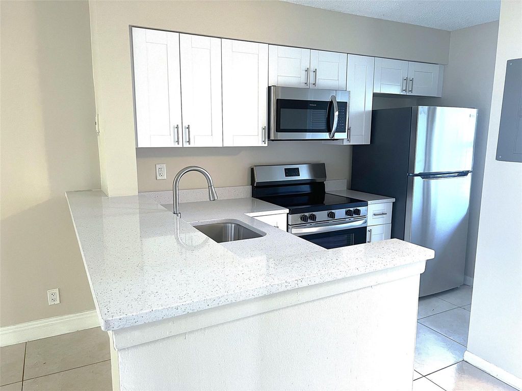 Photo of 2228 N Cypress Bend Drive #201, Pompano Beach, FL 33069 (MLS # F10439382)