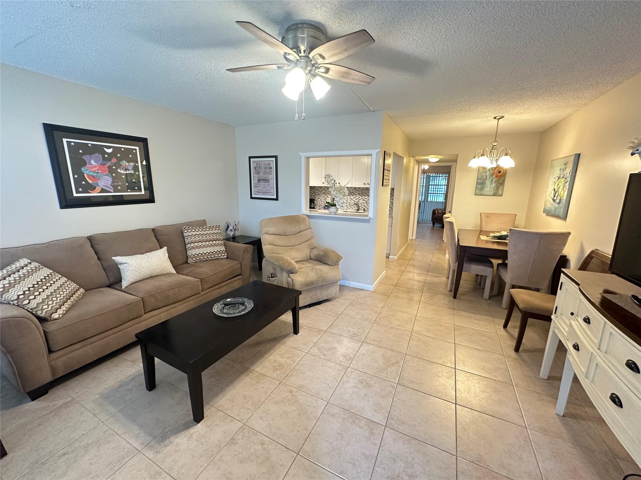 PRICED TO SELL!! IMMACULATE & COZY 1 bedrm, 1 bath condo on the 1st flr! RENTABLE BULDING! GREAT LOCATION.... walk to pool & tennis!! Updated kit w/white modern cabs, quartz cntrs, ss appl, Remodeled bathrm w/tile walls & flrs & new vanity! Encl patio w/ A/C & ACCORDION SHUTTERS for security overlooking a serene garden view! Furnished & ready to move RIGHT in! Century Village is a an active, adult gated community w/24 hr sec, free bus service, a fabulous clubhouse & state of the art gym, pools, tennis, pickleball, shuffleball,bocci ball, cafe & putting green. Enjoy clubs, classes, dancing, singing, billiards, sauna, free movies, theater & more! Min. to Deerfield Beach, Shopping, restaurants, major hwys! DON'T MISS THIS GREAT OPPORTUNITY! YOU WILL LOVE LIVING HERE!! Assoc. Claims 55+