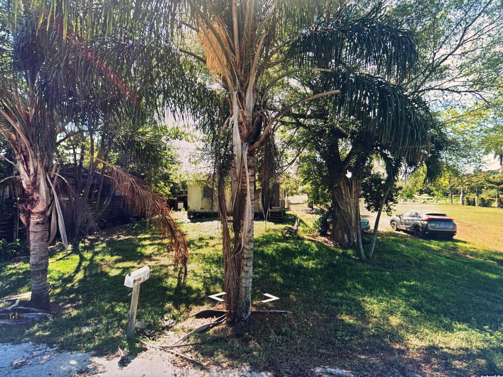 Photo of 1624 NW Avenue L, Belle Glade, FL 33430 (MLS # R11161720)