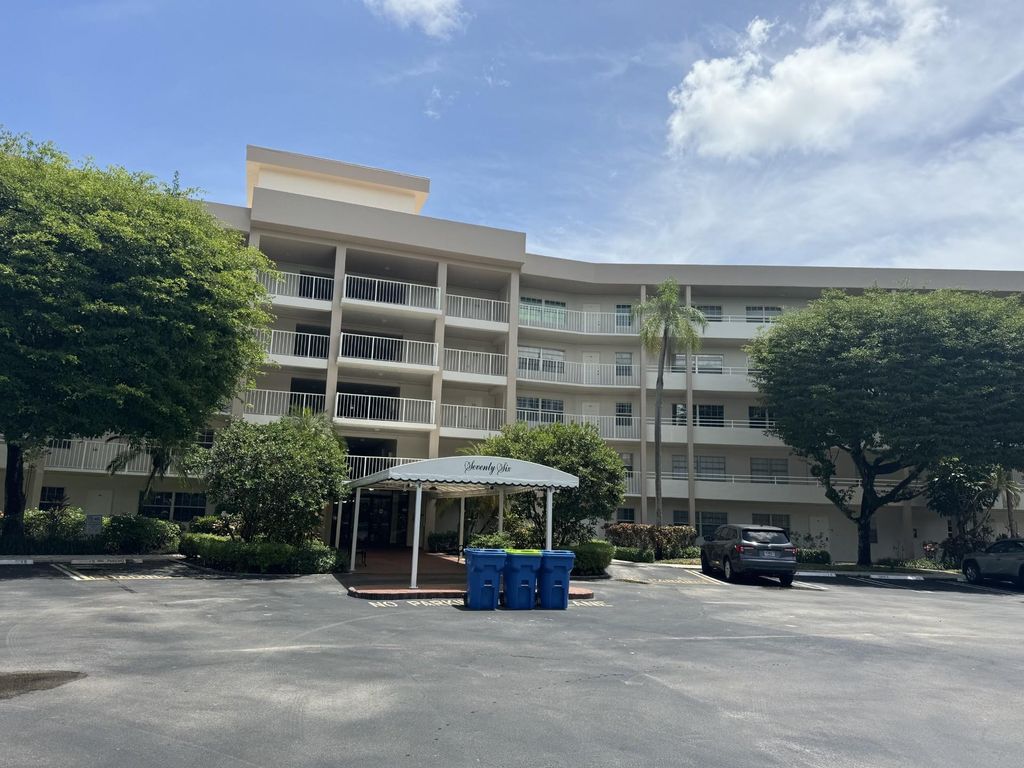 Photo of 3900 Oaks Clubhouse Drive #108, Pompano Beach, FL 33069 (MLS # F10476460)