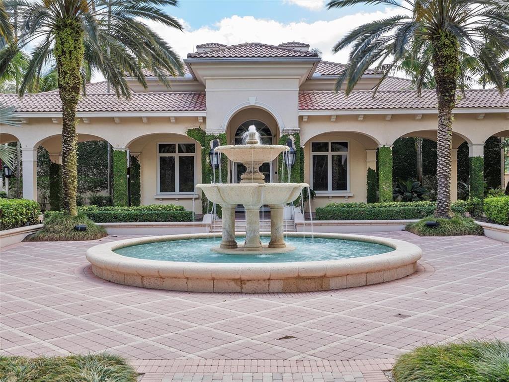 Stunning 4BR/3.5BA waterfront home in prestigious Hawks Landing! Nearly 3,500 sq ft or 4,335 sf on Adjusted bases of luxury with soaring 20' ceilings, a smart split floor plan, and breathtaking long lake views. Bright, open layout with impact windows/doors and beautifully landscaped surroundings. The expansive primary suite features spa-like amenities including a jacuzzi tub, walk-through shower, private lavatory, and bidet. Enjoy modern upgrades like a Tesla charging station, emergency generator, and central sound system with speakers throughout. Community offers a state-of-the-art gym, renovated clubhouse, resort-style pool/spa, championship tennis courts, and pickle ball. Guard-gated for peace of mind. Gigabit internet included. *Estimated rental date subject to change.