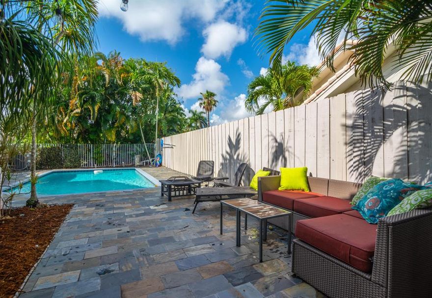 Wonderfully upgraded 2/2 Villa with your very own private pool, backyard AND 2 car garage!!!! New kitchen, with large center island, quartz countertops and stainless steel appliances. Gorgeous wood plank tile flooring. Pool deck has been resurfaced with beautiful slate tile. private back yard and outdoor screened patio. Newer A/C. New water heater and copper piping. Open floorplan with gorgeous vaulted ceilings. Updated master bathroom and walk-in, built out closet. Close to everything! Show and sell this beautiful villa today!! Welcome Home.