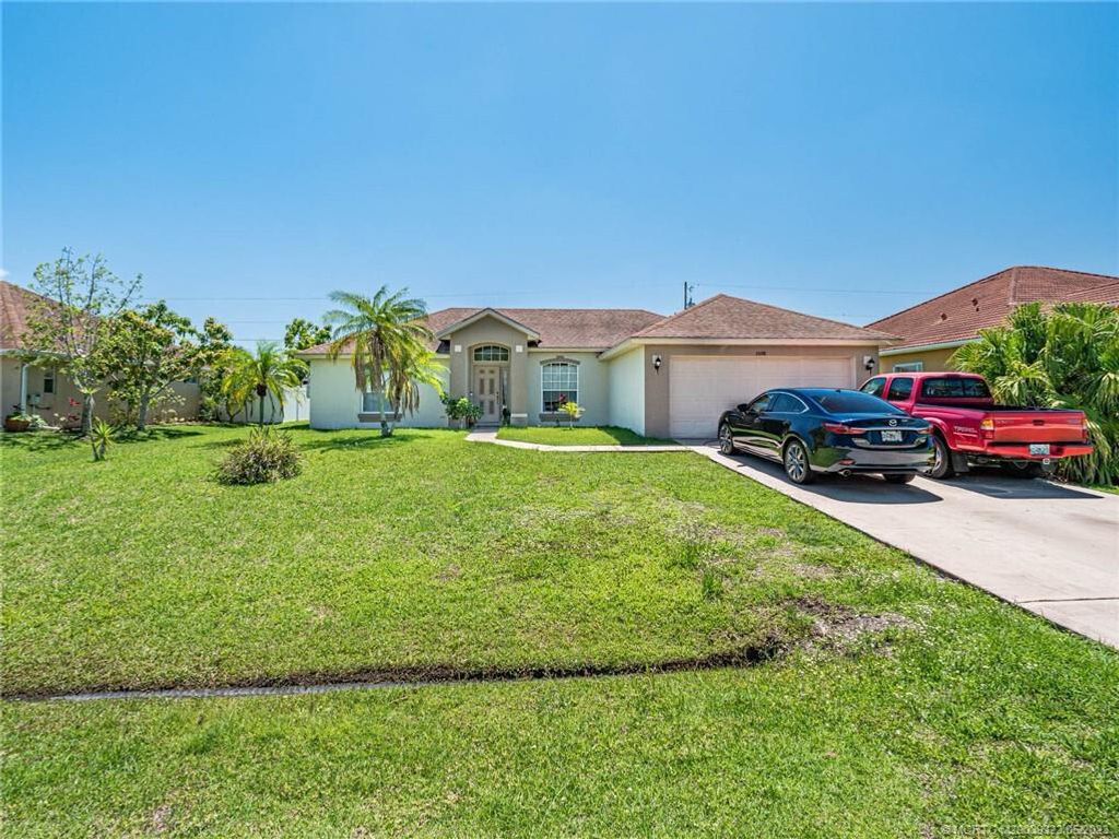 Photo of 2608 SW Fair Isle Road, Port St Lucie, FL 34987 (MLS # R10888470)