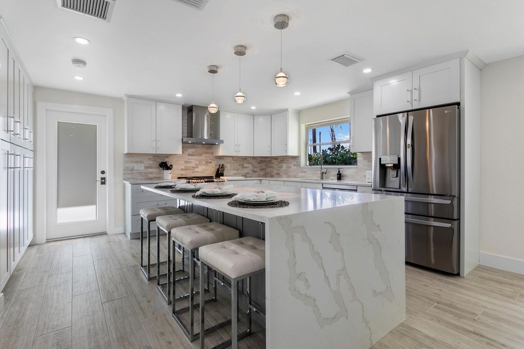 Photo of 700 Eastwind Drive, North Palm Beach, FL 33408 (MLS # R10837356)