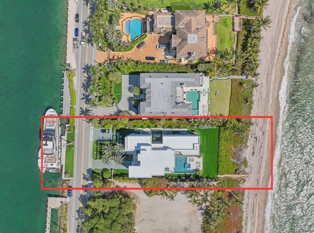Experience the pinnacle of luxury living in this exceptional, MOVE-IN-READY residence that blends sophisticated design with cutting-edge features. This turnkey property offers an unmatched lifestyle, with breathtaking panoramic views of both the private ocean and Intracoastal waters surrounding the entire estate. Wake up each day to a serene waterfront horizon in a home that truly defines elegance and exclusivity. This brand new built home is being sold TURN-KEY, so simply bring your clothes and personal items. 999 Hillsboro is built like a fortress using the latest building code with waterproofed concrete exterior and hurricane resistant impact doors/windows. The matching porcelain exterior complements the 74-foot lap saltwater pool, making this home not just a place to live, but a