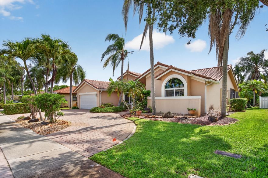 This North Springs home truly checks every box, offering the perfect blend of space and value in a quiet neighborhood with no HOA fees. You will love being zoned for A-rated schools while enjoying a generous 9,375-square-foot lot. The interior feels bright and open with vaulted ceilings, recessed lighting, and porcelain tile throughout the 2,411 square feet of living space.  The split floorplan is ideal for privacy, while the open kitchen and living area with a wet bar are made for entertaining. Step outside to your screened patio and large pool, surrounded by a massive backyard perfect for weekend gatherings. Complete with a two-car garage and hurricane protection, this property is a rare find in the Coral Springs area. Please note that some photos have been virtually staged to show the home's possibilities. This property is a great opportunity to add your own style and build instant equity. The pool is currently in need of a new pump and some general TLC to return it to its full potential. It is the perfect chance to customize your outdoor oasis exactly the way you want it in a prime North Springs location.