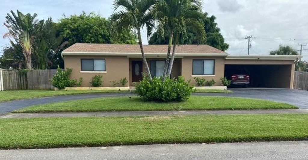 Photo of 344 Date Palm Drive, Lake Park, FL 33403 (MLS # R11104573)