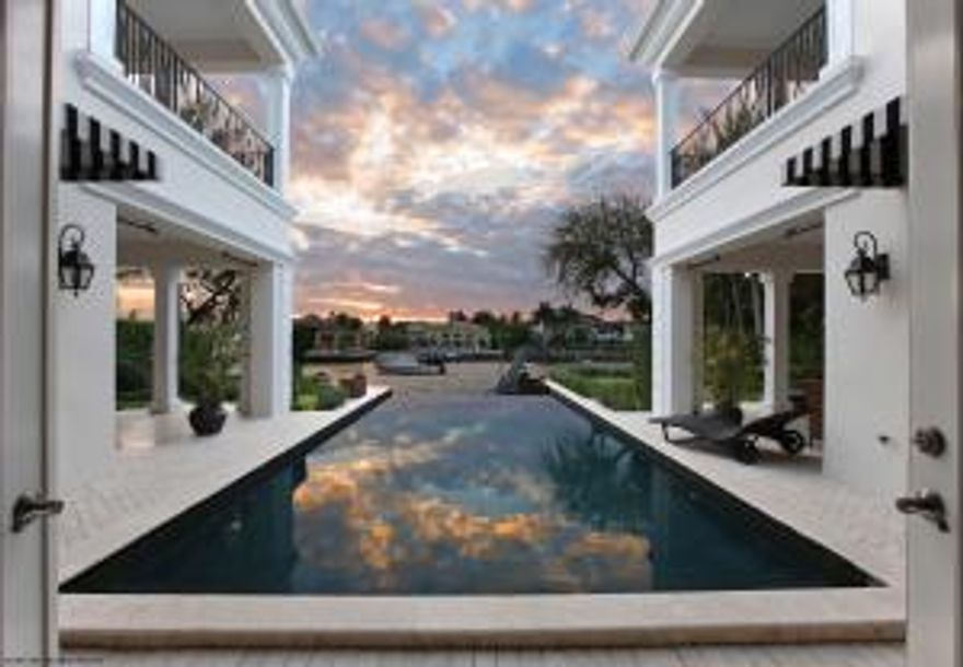 Grandly-proportioned private gated waterfront estate in Boca Raton's most prestigious enclave epitomizes South Florida luxury at its best. Nestled on a third of an acre of pristine island-side grounds, with over 90+/-' of Intracoastal Waterway awaits in this exclusive retreat and a one-of-a-kind offering.