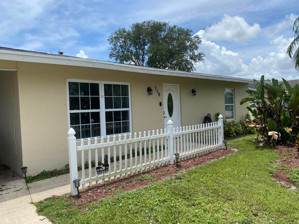 Photo of 158 SW Ray Avenue, Port Saint Lucie, FL 34983 (MLS # R10813476)