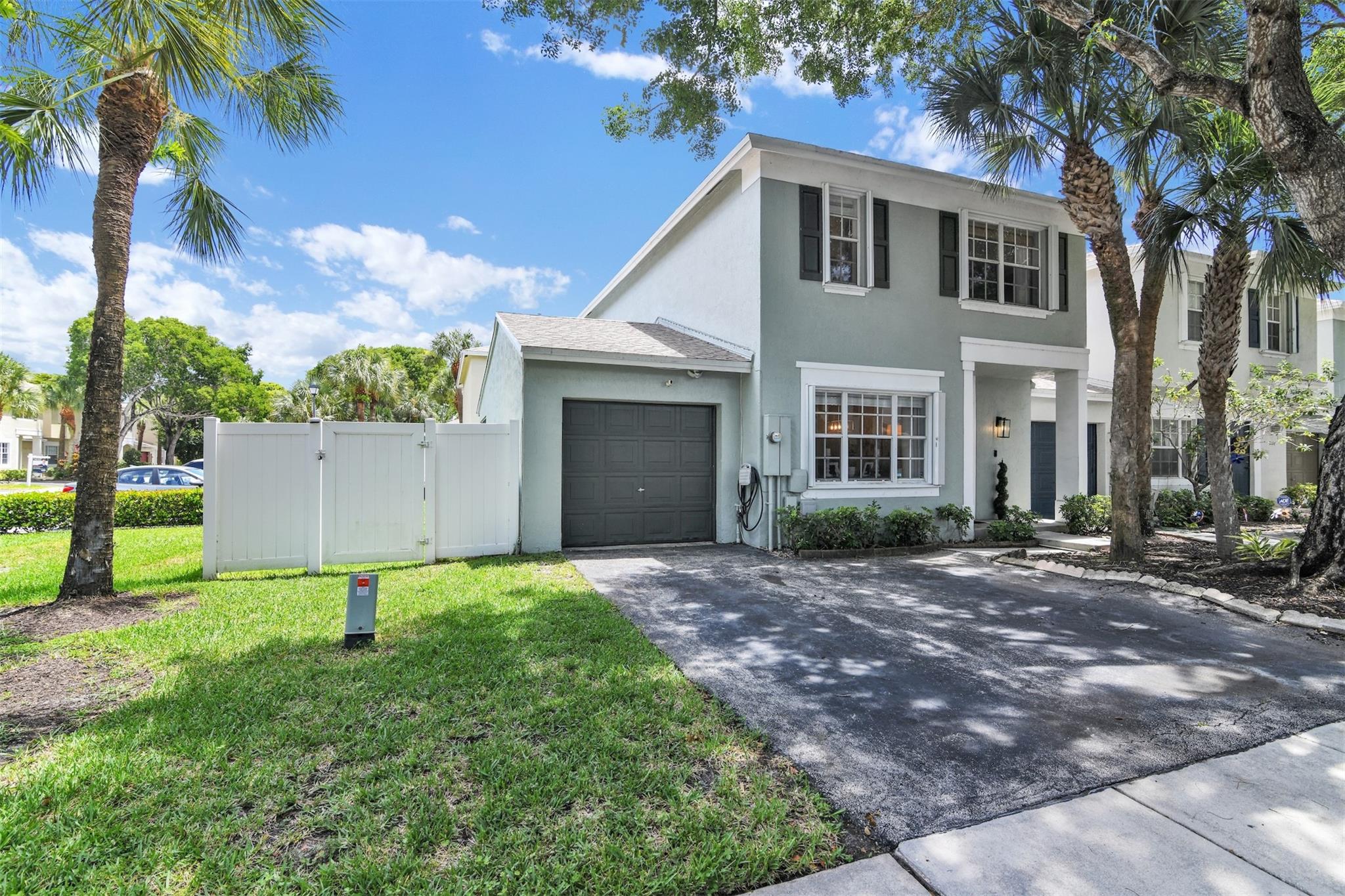 Don’t miss this spacious updated 3 bedroom, 2.5 bathroom 1 car garage, townhouse located in Plum Bay! The modern kitchen has quartz counter tops and stainless steel appliances. Bathrooms are fully renovated and offer both style and functionality. The floor plan layout offers separate living and family room corridors. Located on a desirable corner lot, enjoy your own private oasis with a large fenced yard and a screened-in porch—perfect for outdoor dining or relaxing in peace. This townhouse is equipped with hurricane accordion shutters for added security and a brand new air conditioning system. Located minutes to the Sawgrass Expressway, this move-in ready gem offers space and upgrades. This home combines low-maintenance living with the feel of a single-family home. Schedule a showing!
