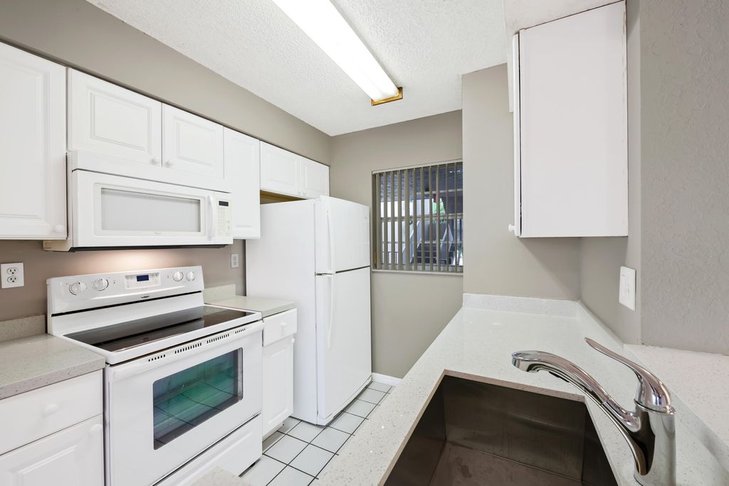 Photo of 2861 N Oakland Forest Drive #202, Oakland Park, FL 33309 (MLS # B26026732)