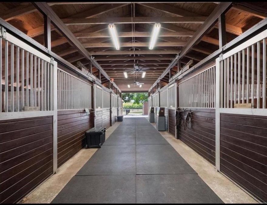 40 Stalls available in sought after Saddle Trail just a short hack from WEF! Included is a new 110x200 sand jumping ring, large grand prix grass riding field with easy access to the bridle path and ample paddock space! Grooms and Trainers Apartments available. You and your horses will love this serene, tranquil property this season!