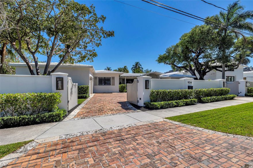 Hot Hot Rio Vista 4 bed, 4 bath home is a one story stunner! This home offers an impressive 13,343 sqft lot with 110 feet of fixed bridge waterfront on S. Rio Vista Blvd & is located directly across from the park. This one-story estate compound, spanning over 13,000 sqft, promises both serenity & security. The circular automatic gated front yard adds a touch of elegance & ensures privacy & peace of mind. The large master bedroom & split floor plan caters perfectly to families or anyone seeking an open single-story living experience. Recent seawall inspection provides assurance regarding the property's waterfront integrity, adding to the overall peace of mind to this exquisite piece of land. Owners have found their next house and ready to sell.