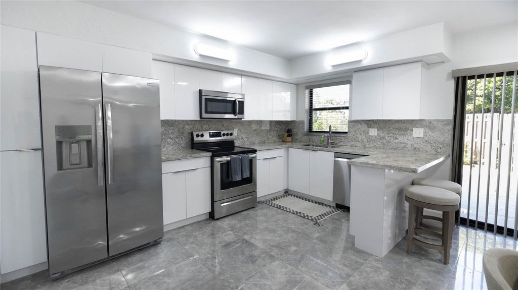 Photo of 8204 SW 23rd Street #D, North Lauderdale, FL 33068 (MLS # F10532932)