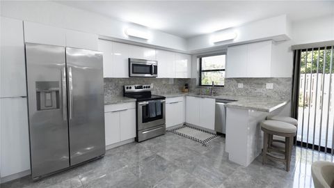 Tiny photo for 8204 SW 23rd Street #D, North Lauderdale, FL 33068 (MLS # F10532932)