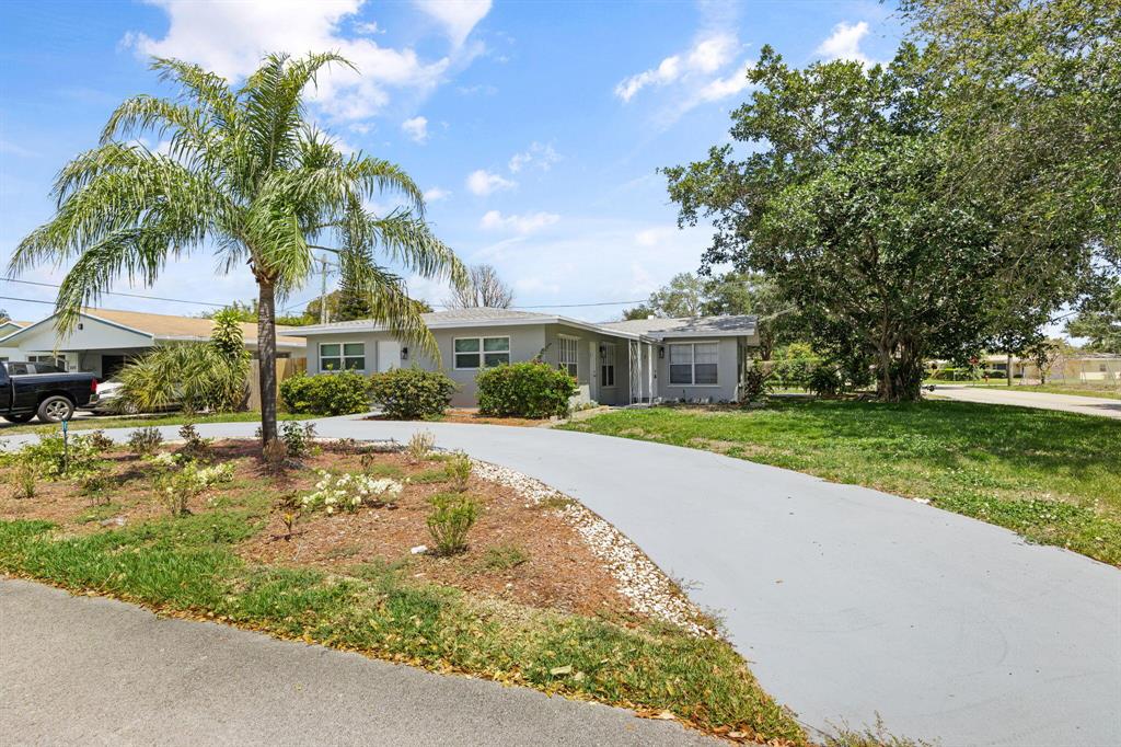 This tastefully newly renovated 2 bedroom 2 bathroom home with primary bedroom ensuite bathroom, extra storage, laundry room, and ample carport and driveway parking is available immediately. This lovely home is situated in a quiet, water-privileged neighborhood offering public boat ramps, and water access. Just minutes from the intracoastal, and the beach, this duplex is waiting for you to call it home! Bring your pets, your bikes, and your boat!