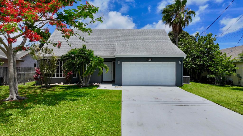 Photo of 6048 Garrett Street, Jupiter, FL 33458 (MLS # B26032136)