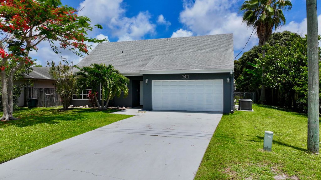 Photo of 6048 Garrett Street, Jupiter, FL 33458 (MLS # B26032136)