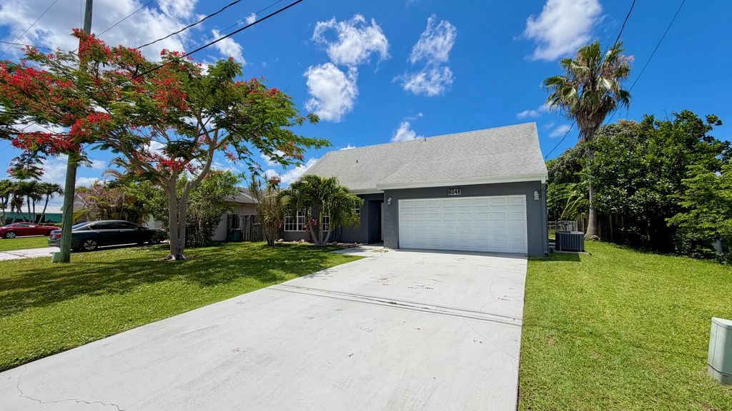 Photo of 6048 Garrett Street, Jupiter, FL 33458 (MLS # B26032136)