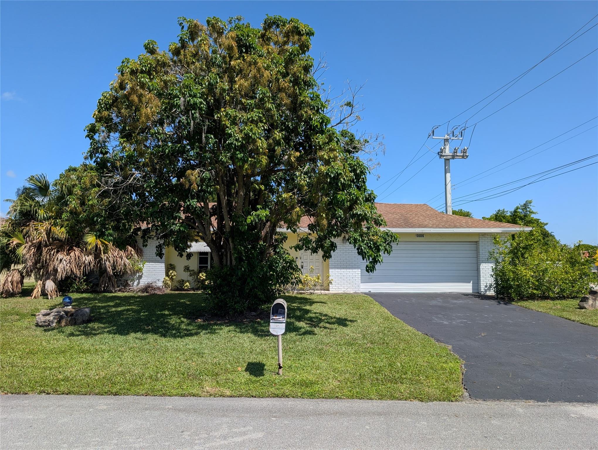 Priced to sell, property offers great potential for those with a vision. Large corner lot backing a wide canal that's great for fishing. Low HOA with the clubhouse and pool located directly across the street. The 3rd bedroom has been open and being utilized as a family room, but can easily be reconverted back to its original three bedroom configuration. Don't miss out on the opportunity of customizing this home to meet your needs.