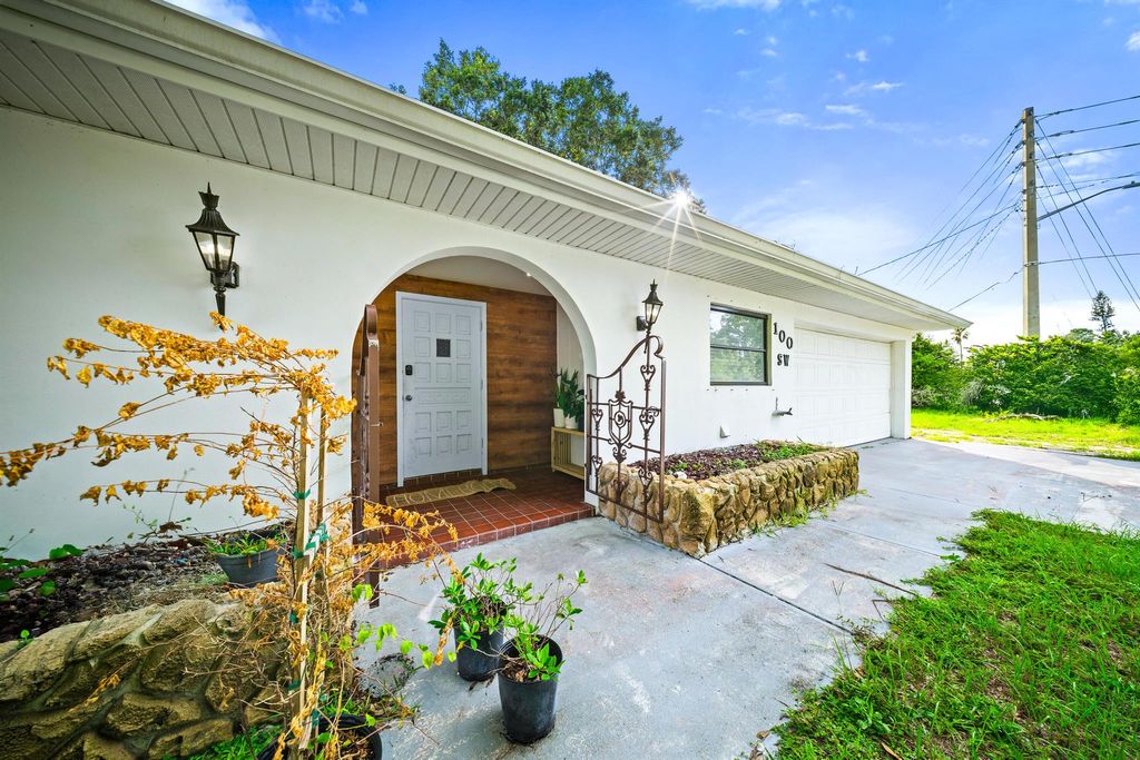 Photo of 100 SW Lakehurst Drive, Port Saint Lucie, FL 34983 (MLS # R11125619)