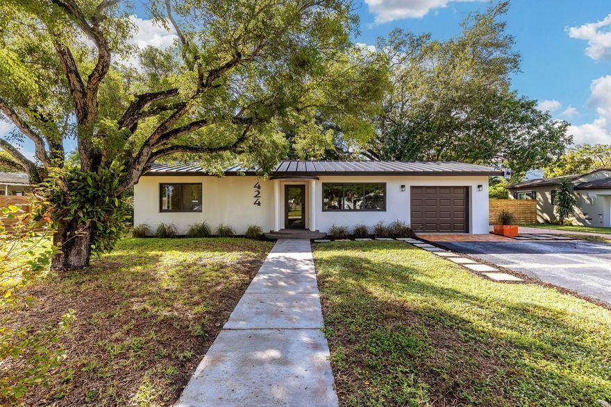 Join the excitement of Pompano Beach!   This completely renovated and modernized 4 bedroom 3 bath home nestled among old growth trees on a 14,101 sf  double lot in the heart of it all.  Perfect location for the active South Florida lifestyle with parks, running paths and the Pompano Beach Amphitheater in the neighborhood.  Walking distance to restaurants and shops in Old Town Square and minutes from the vibrant restaurant district at the beach and fishing pier.  One of the fastest growing and most exciting areas to call home.
This home boasts style and modern energy efficiencies that elevate your sense of comfort while being budget friendly in this coveted east side location.