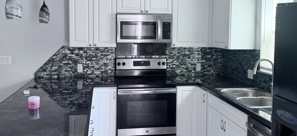Photo of 731 46th Street, West Palm Beach, FL 33407 (MLS # B26012794)