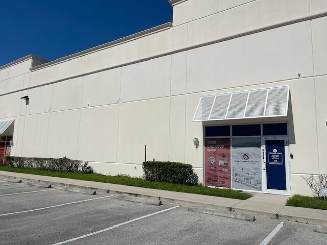 Newly upgraded flex space in the St. Lucie West business district, ideal for warehouse and office use, featuring 20' ceilings, full AC, two loading docks (one standard, one heavy-duty with a ramp), a motorized roll-up door, and a 1,700 sq. ft. second-floor office with a conference room. Amenities include two restrooms, a break room, a kitchen, a reception desk, two glass-walled offices, polished concrete warehouse floors, commercial-grade carpet in offices, a full sound system, and a security camera system. Lease rate $17/SF NNN.