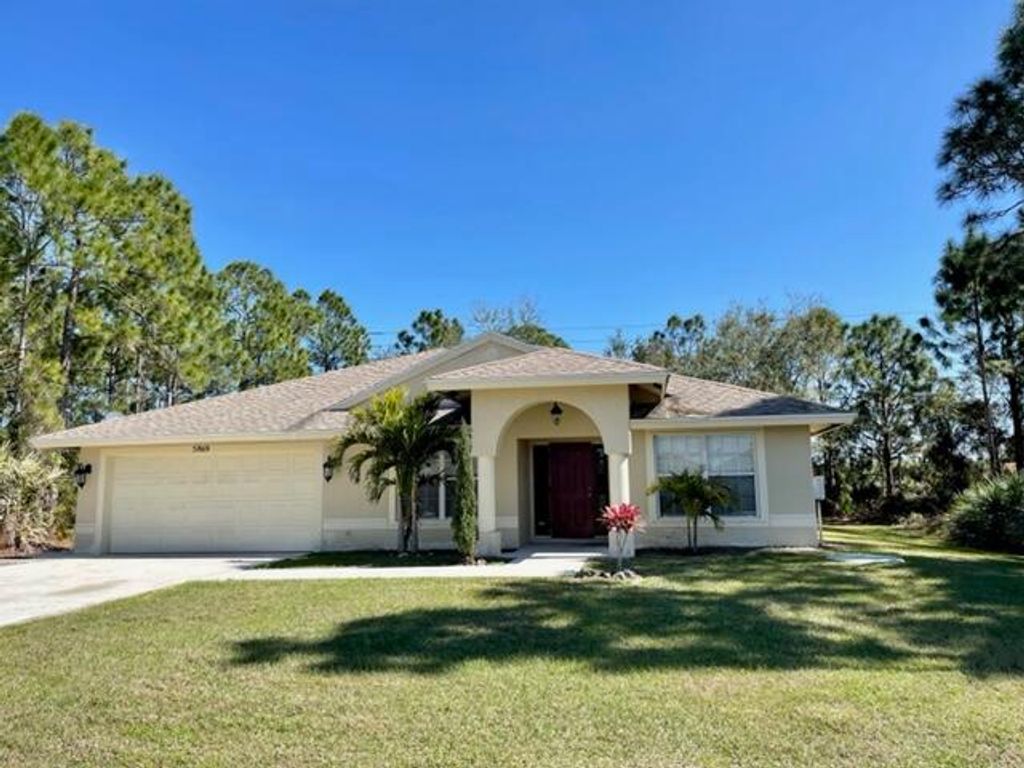 Photo of 5869 NW Carovel Avenue Ave, Port St Lucie, FL 34986 (MLS # R10777099)