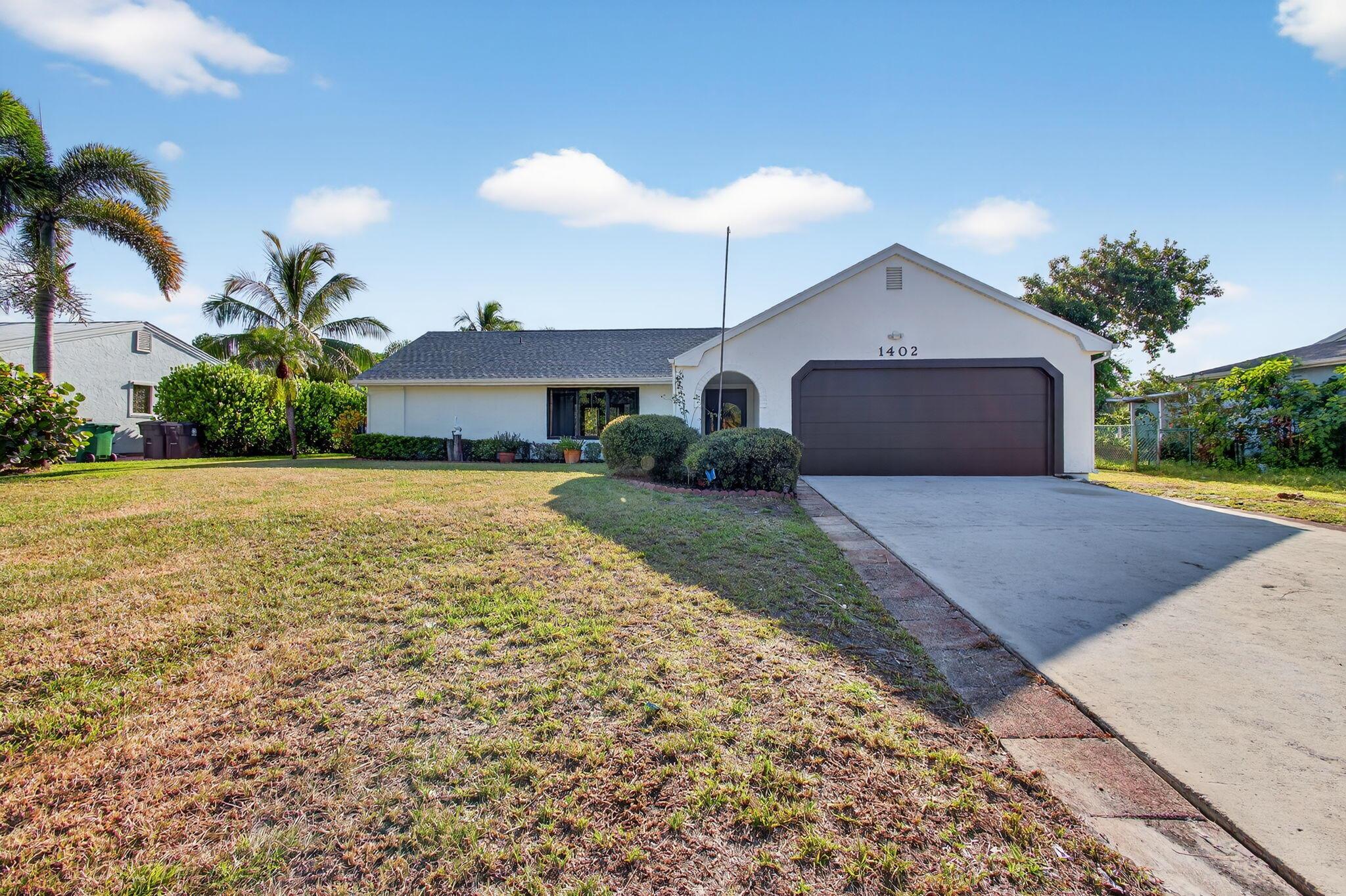 Step into comfort, style, and peace of mind in this beautifully updated 3/2/2 home tucked away in a quiet neighborhood with easy access to U.S.1. Key upgrades include a newer A/C (2023), water heater (2024), and impact-rated Cat 5 windows and doors (2025). The home boasts a freshly remodeled interior with a modern aesthetic, featuring ceramic tile flooring throughout, a kitchen with a waterfall granite countertop, and new stainless-steel appliances. An extended screened lanai overlooks a tropical backyard complete with a mango tree and a preserve-view, plus a storage shed. This move-in ready home blends contemporary design with natural beauty. Don't miss this gem--schedule your private tour today!