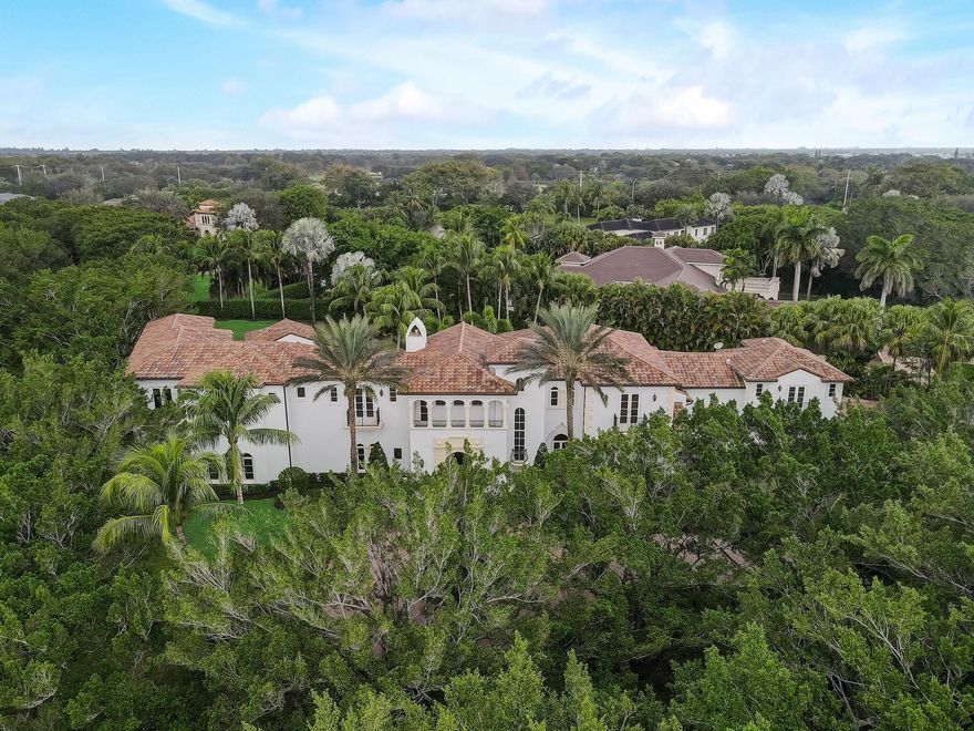 Indulge in the lap of luxury with the one-of-a-kind Mediterranean mansion, an oasis of comfort and privacy that's sure to take your breath away. Boasting a massive 11,889  sq ft, this 9 bed, 11.3 bath marvel is the epitome of lavish living. Nestled within Long Lake Estate's lush greenery, this spacious gem comes with a staggering 1.35-acre plot of land- one of the largest in the area!  From the impressive impact glass to the 4-car garage and marble baths, this home is a true testament to exquisite taste and attention to detail. Enjoy movie nights in your own private theater room, or take a stroll through the expansive grounds. Your dream of opulence and tranquility await in Boca Raton's finest estate.