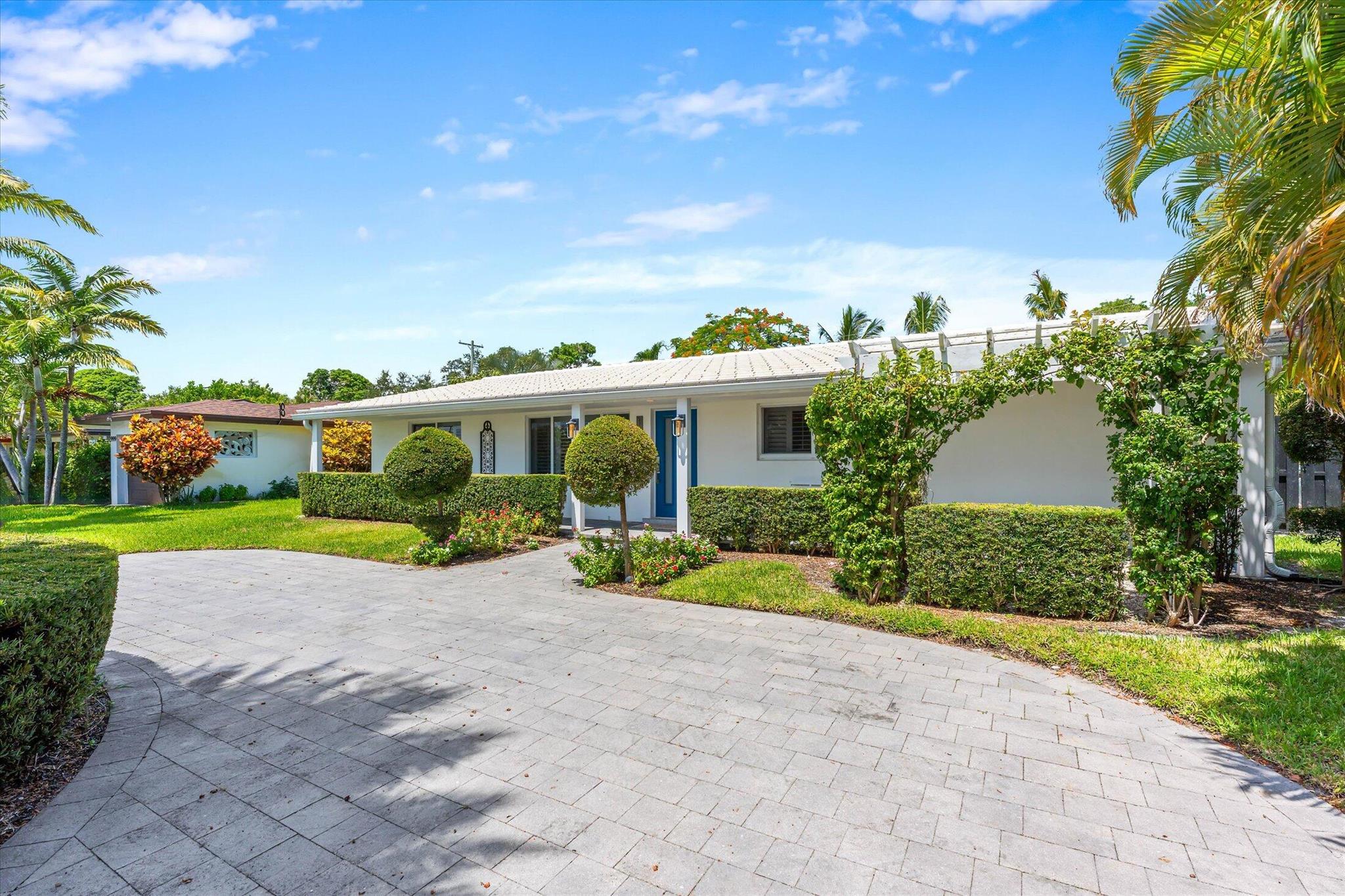 Charming one-story 3 bed/2 bath home in Varsity Heights/Spanish Village in East Boca! Move in ready, with lovely kitchen overlooking the backyard. Features spacious bedrooms, tile throughout, extra bonus room in the back of the home currently used as a family room. Washer and Dryer IN the house! Gorgeous backyard, fully fenced and generous paver patio to enjoy the outdoors. Hurricane Windows throughout for peace of mind. Lovely circular driveway for all your parking needs!Located just minutes from FAU, downtown Boca, the beach, parks, tennis center, and the Brightline station, this home also benefits from A+ rated schools. A must-see for anyone looking for a stylish, move-in-ready rental in an ideal location! Make it home today!