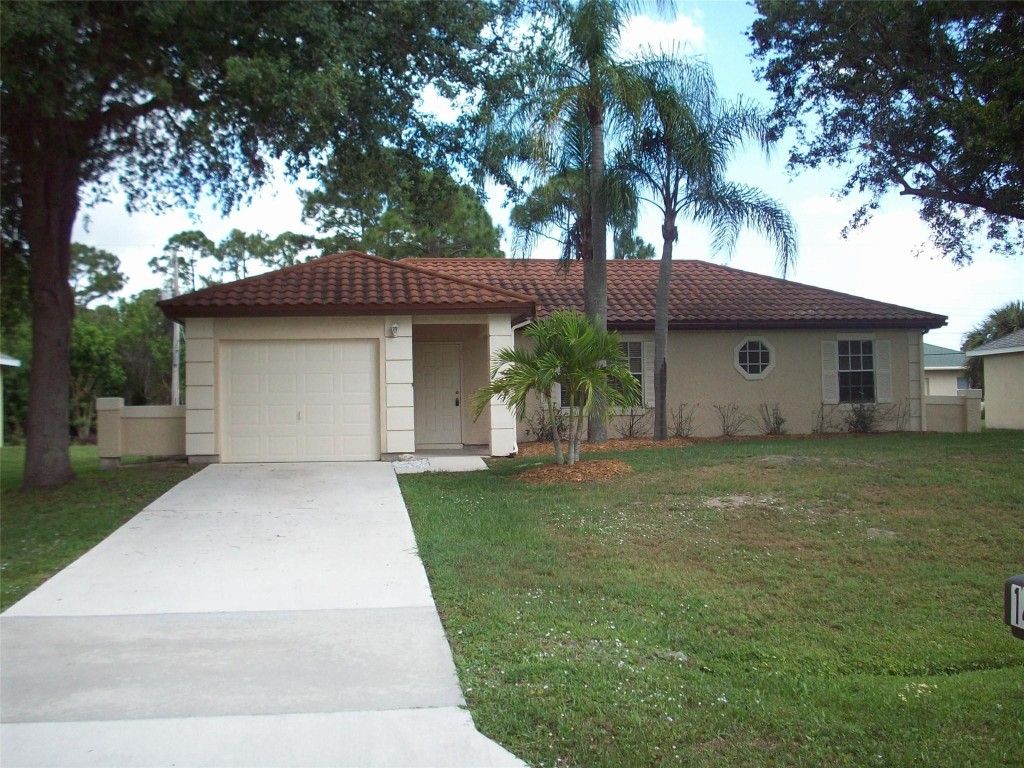 Photo of 1487 SW Leisure Lane, Port Saint Lucie, FL 34953 (MLS # F10525136)