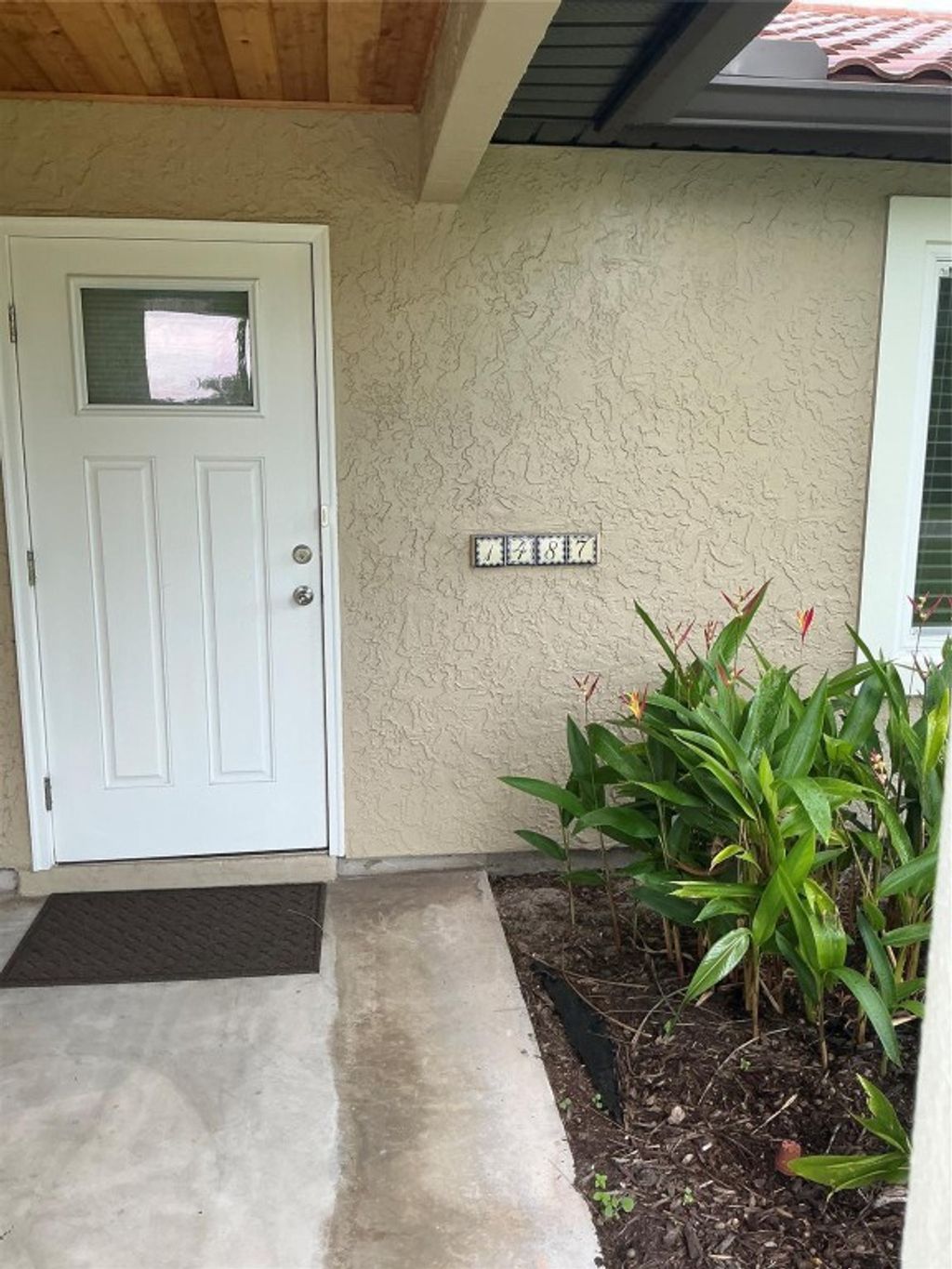 Photo of 1487 SW Leisure Lane, Port Saint Lucie, FL 34953 (MLS # F10525136)
