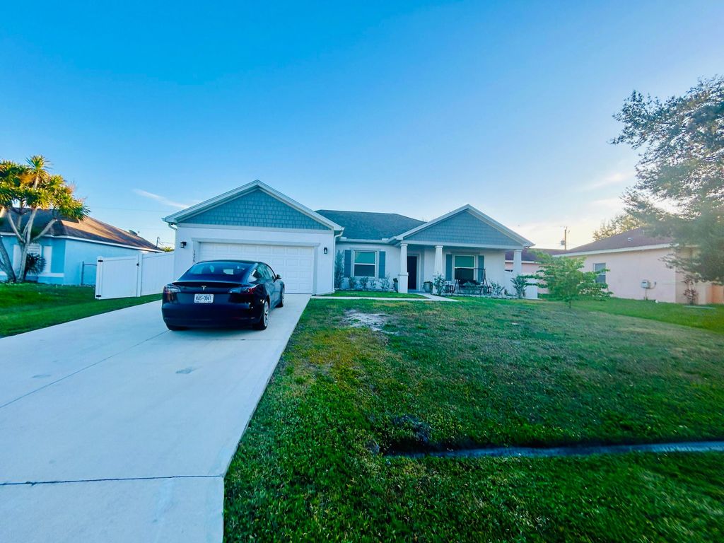 Photo of 1626 SW Neptune Avenue, Port Saint Lucie, FL 34953 (MLS # R11159353)